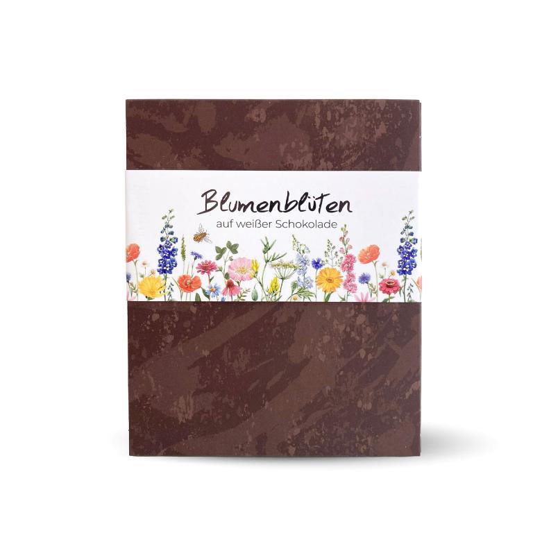 Blumenblueten-auf-weisser-Schokolade-Bienenhaus-Freinberg-Bienenprodukte-und-Imkereibedarf-Schokolade-und-Suesses